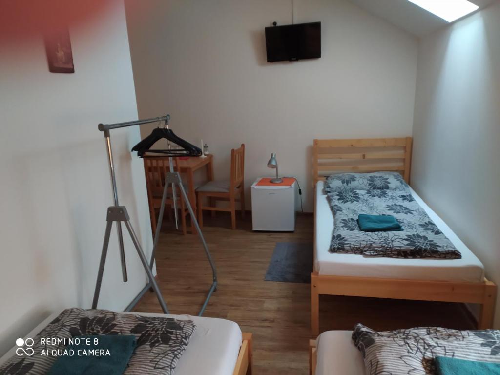 Postel nebo postele na pokoji v ubytování Břeclav centrum - U Pražáka