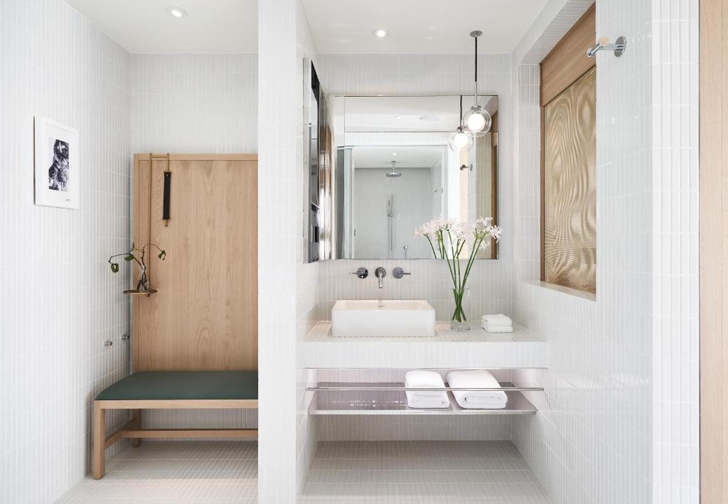 a bathroom with a sink and a mirror at Kimpton Da An Taipei- an IHG Hotel in Taipei