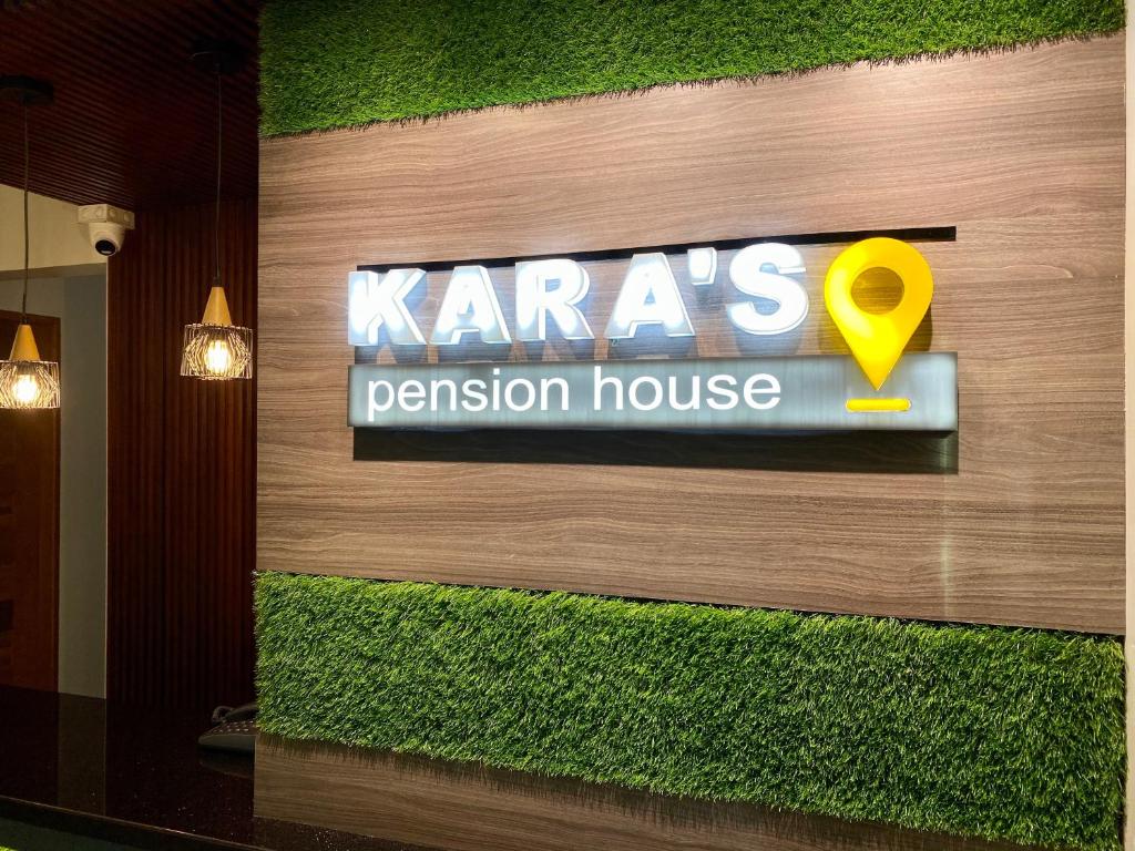 a sign on the wall of a karma passion house at Kara’s Pension House in Tuguegarao City