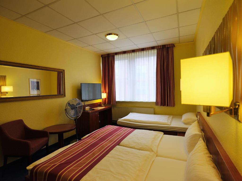 Postel nebo postele na pokoji v ubytování Cabo Nonsmoking-Hotel 