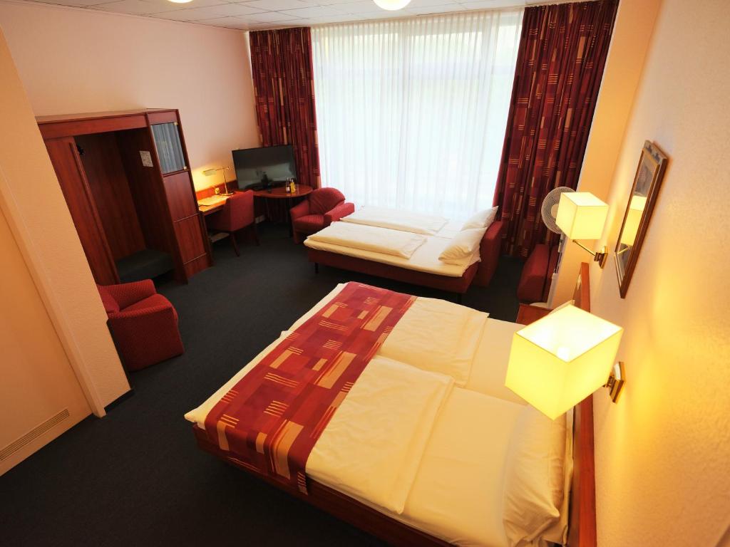 Postel nebo postele na pokoji v ubytování Cabo Nonsmoking-Hotel 