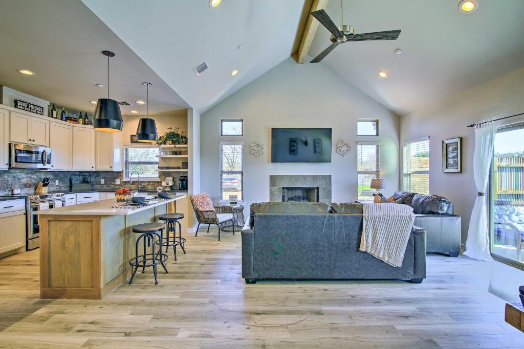 a kitchen and living room with a couch and a table at Uncorked Ranch Hill Country Home 1Mi to Winery! in Fredericksburg