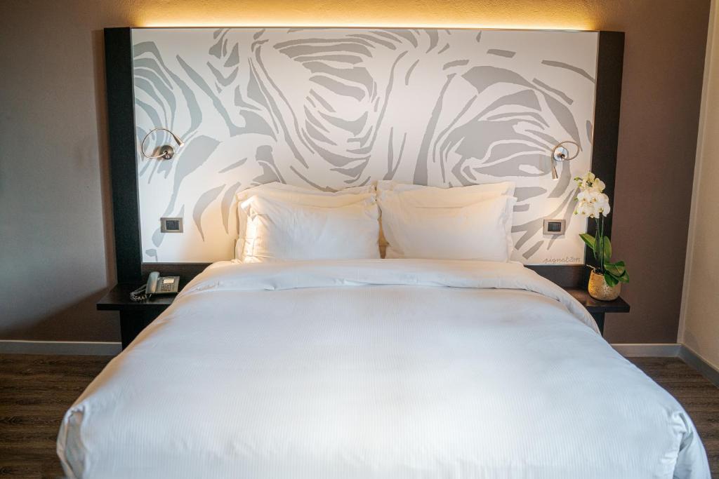 Postel nebo postele na pokoji v ubytování Hotel Franz