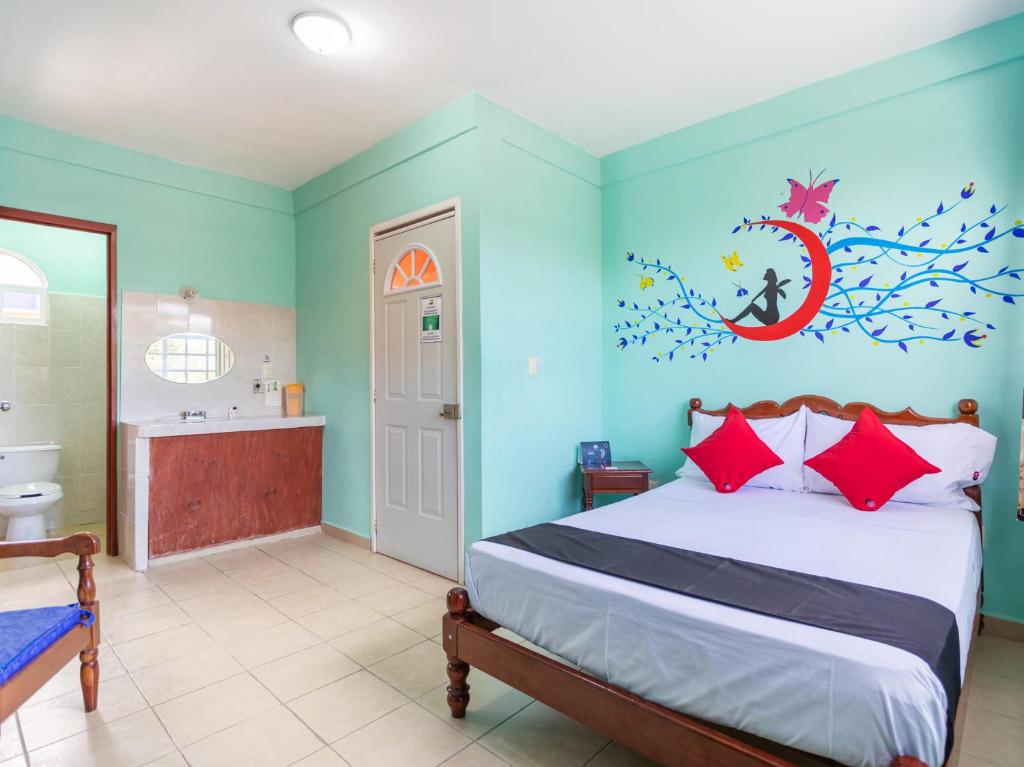 Postel nebo postele na pokoji v ubytování Hotel Hacienda Bacalar