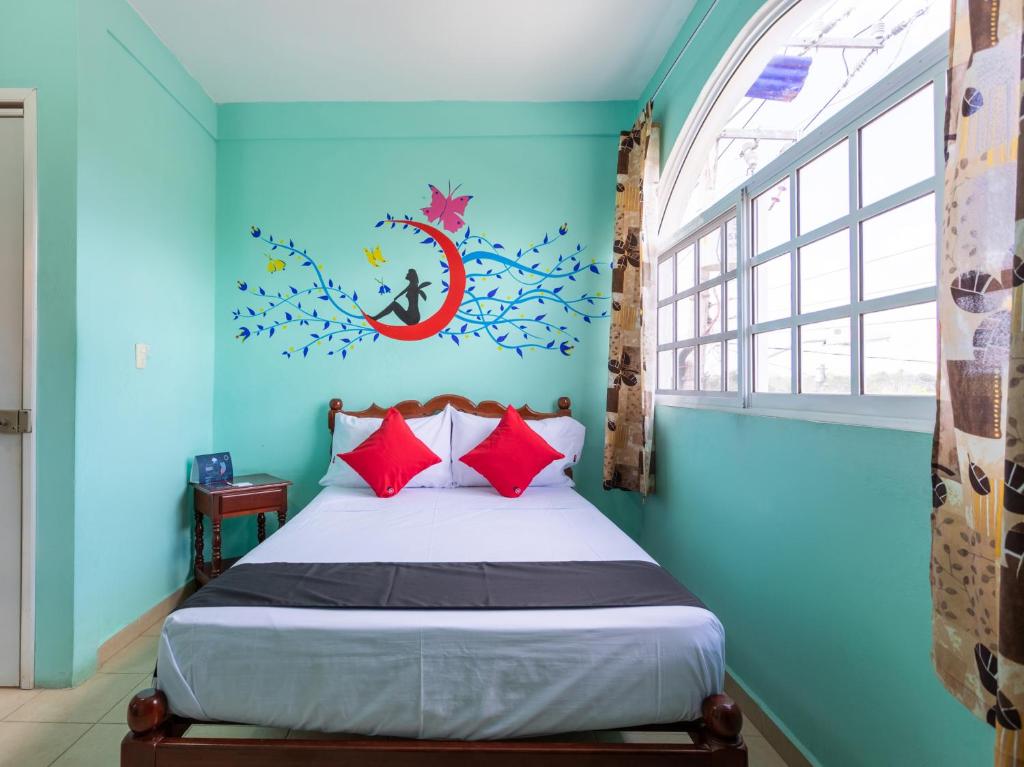 Postel nebo postele na pokoji v ubytování Hotel Hacienda Bacalar