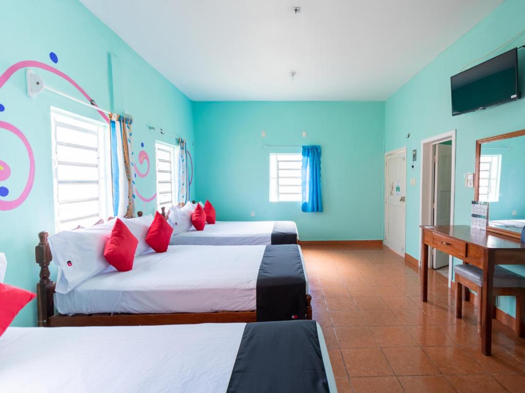 Postel nebo postele na pokoji v ubytování Hotel Hacienda Bacalar