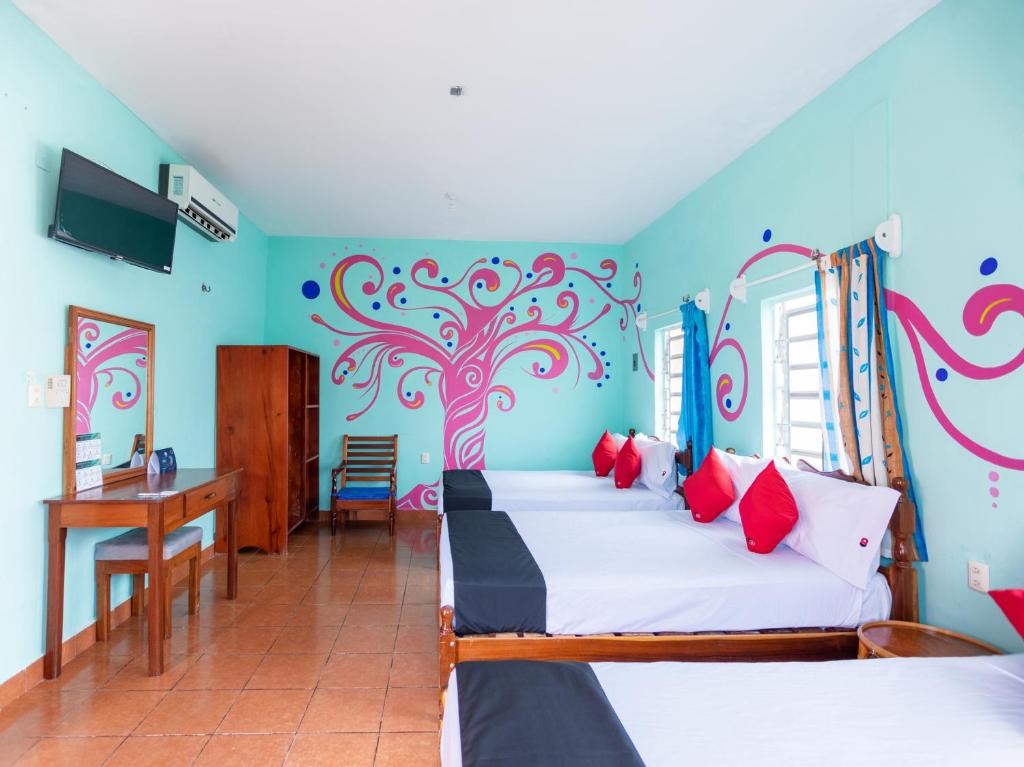Postel nebo postele na pokoji v ubytování Hotel Hacienda Bacalar
