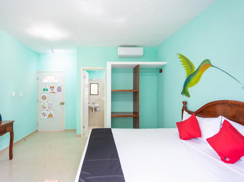 Postel nebo postele na pokoji v ubytování Hotel Hacienda Bacalar