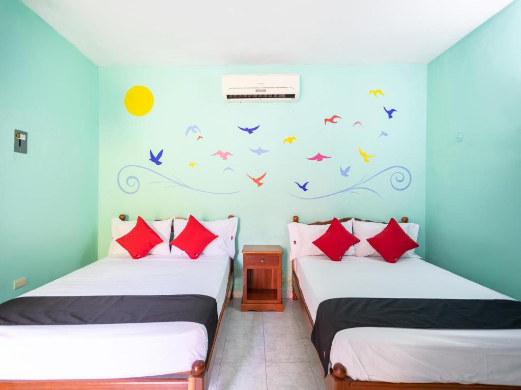 Postel nebo postele na pokoji v ubytování Hotel Hacienda Bacalar