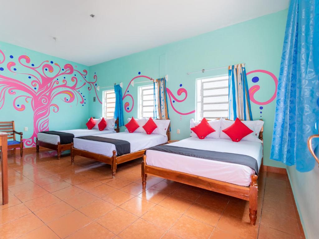 Postel nebo postele na pokoji v ubytování Hotel Hacienda Bacalar