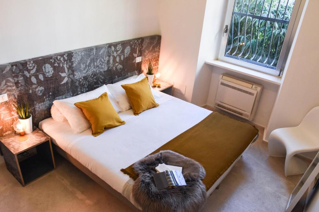 Postel nebo postele na pokoji v ubytování Garibaldi23 Rooms