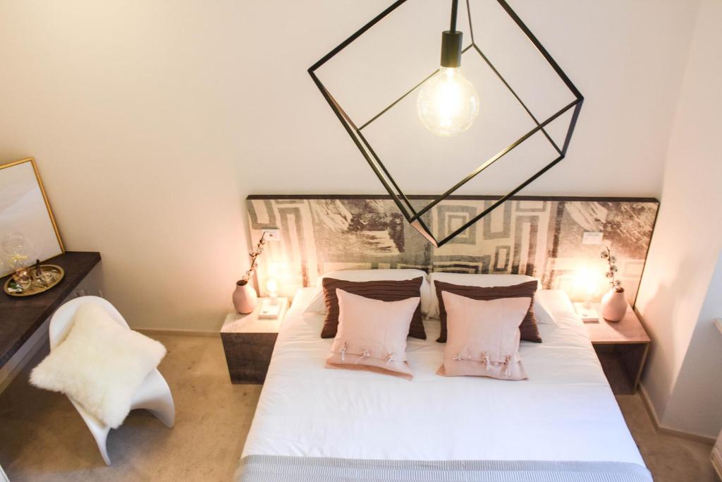 Postel nebo postele na pokoji v ubytování Garibaldi23 Rooms