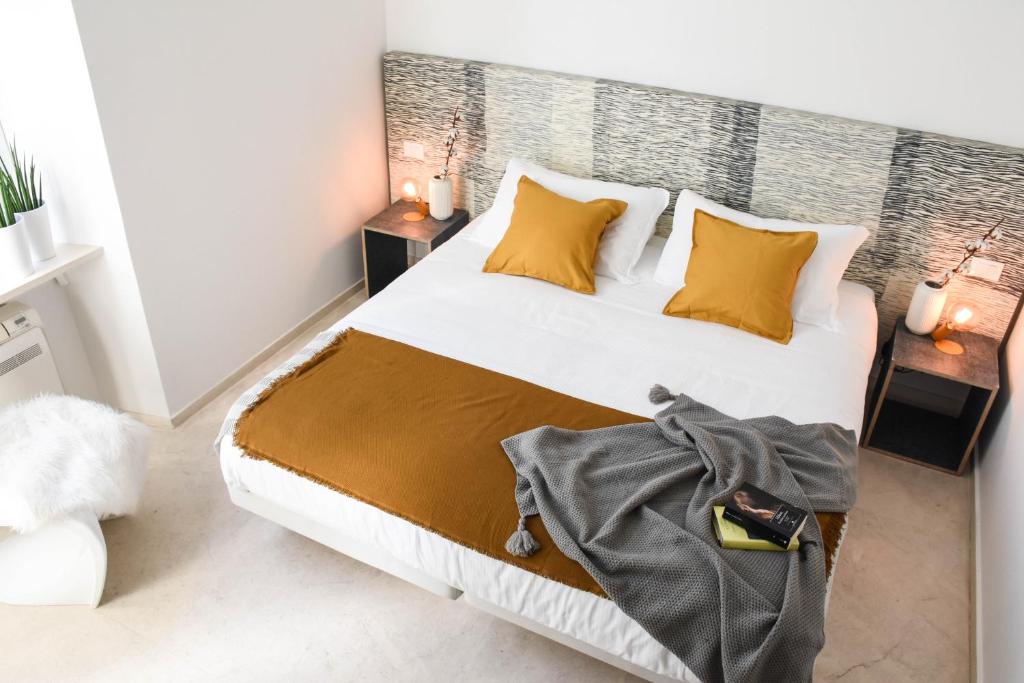 Postel nebo postele na pokoji v ubytování Garibaldi23 Rooms