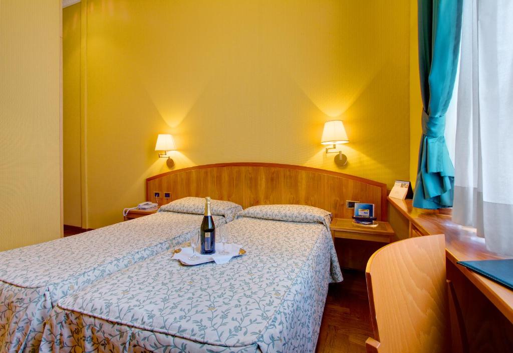 Postel nebo postele na pokoji v ubytování Hotel Corot