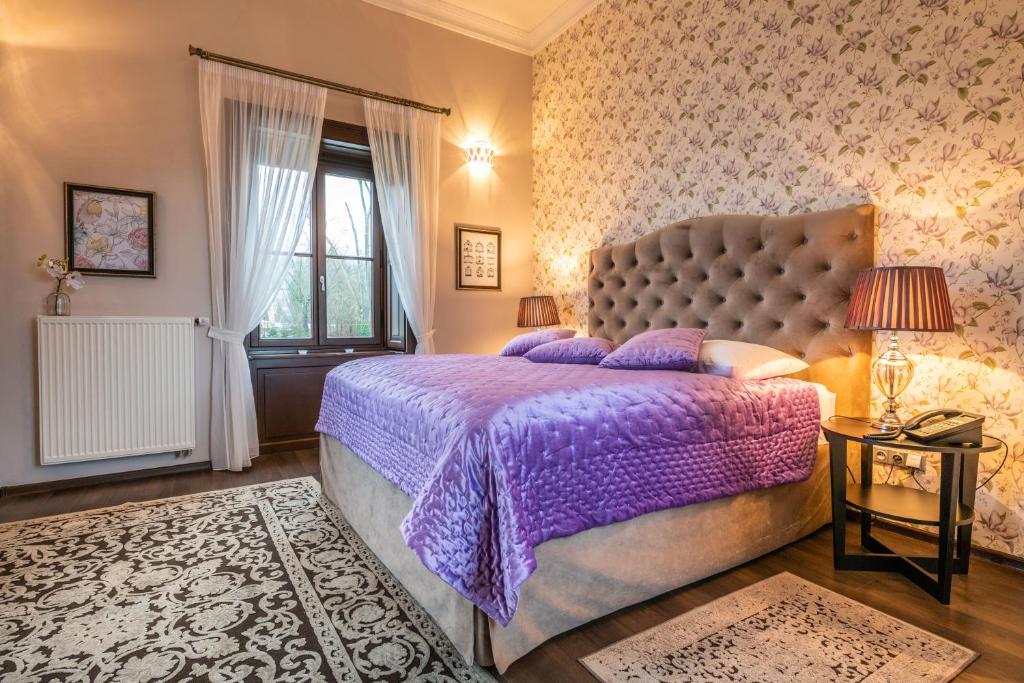 Postel nebo postele na pokoji v ubytování Chateau Appony