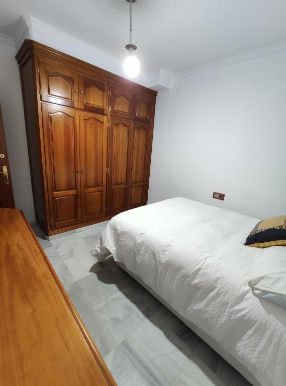 A bed or beds in a room at Plaza de las Infantas, Sanlucar Centro.