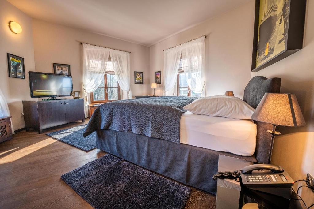 Postel nebo postele na pokoji v ubytování Chateau Appony