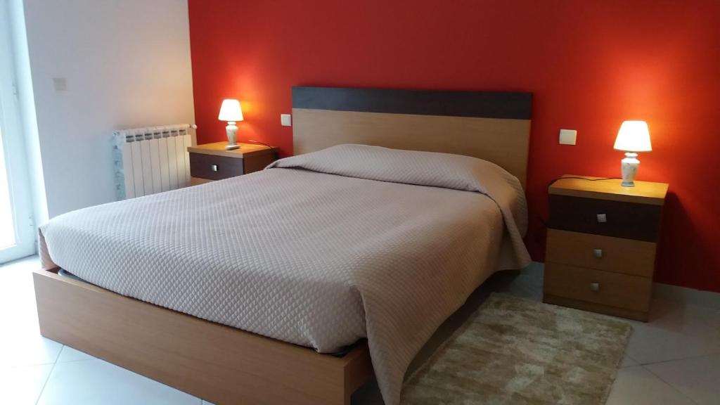 Postel nebo postele na pokoji v ubytování Funileiro, apartamentos e quartos