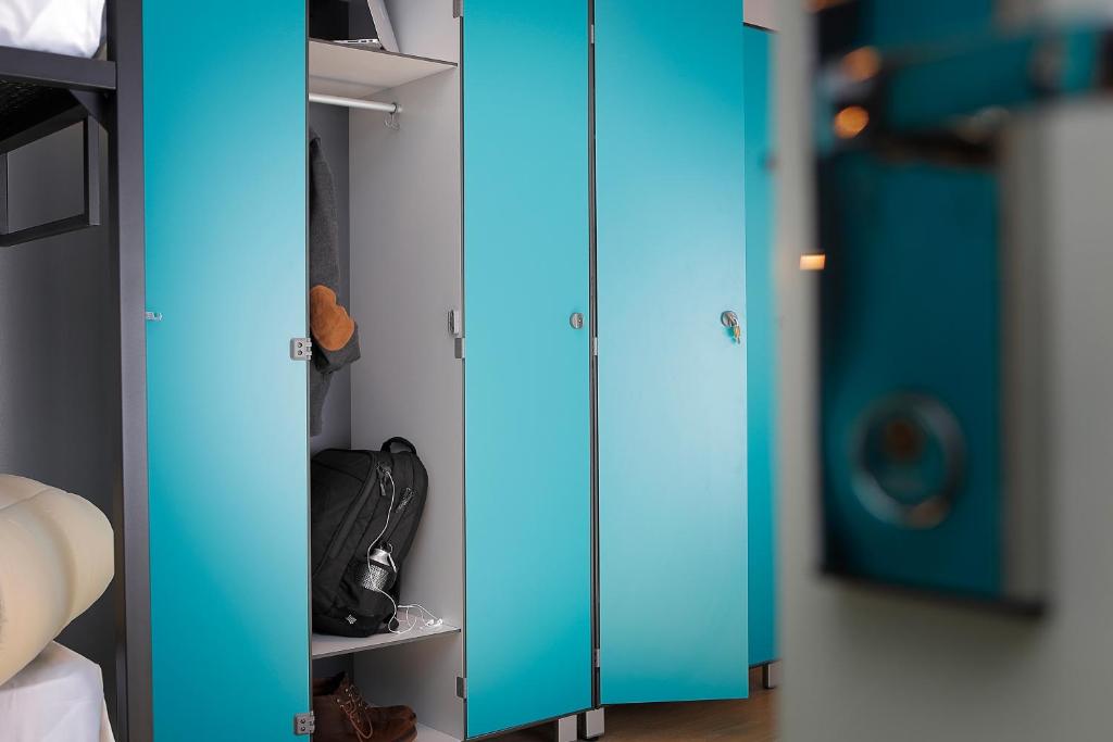 a room with blue glass doors and a closet at Plus Florence in Florence