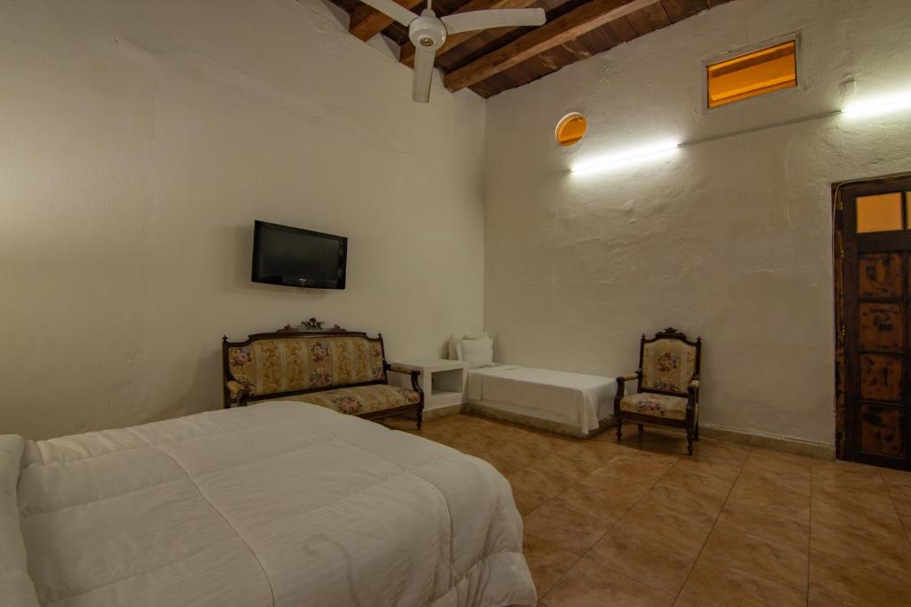 Postel nebo postele na pokoji v ubytování Casa Del Tejadillo