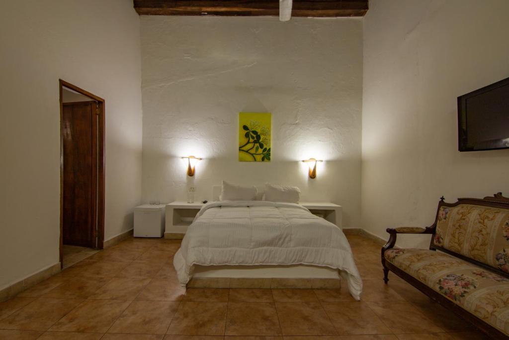 Postel nebo postele na pokoji v ubytování Casa Del Tejadillo