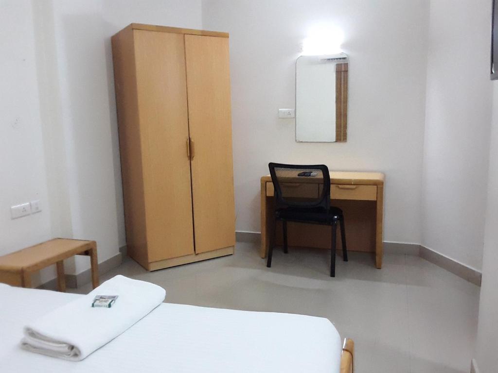 Postel nebo postele na pokoji v ubytování Hotel Tri-Star Residency