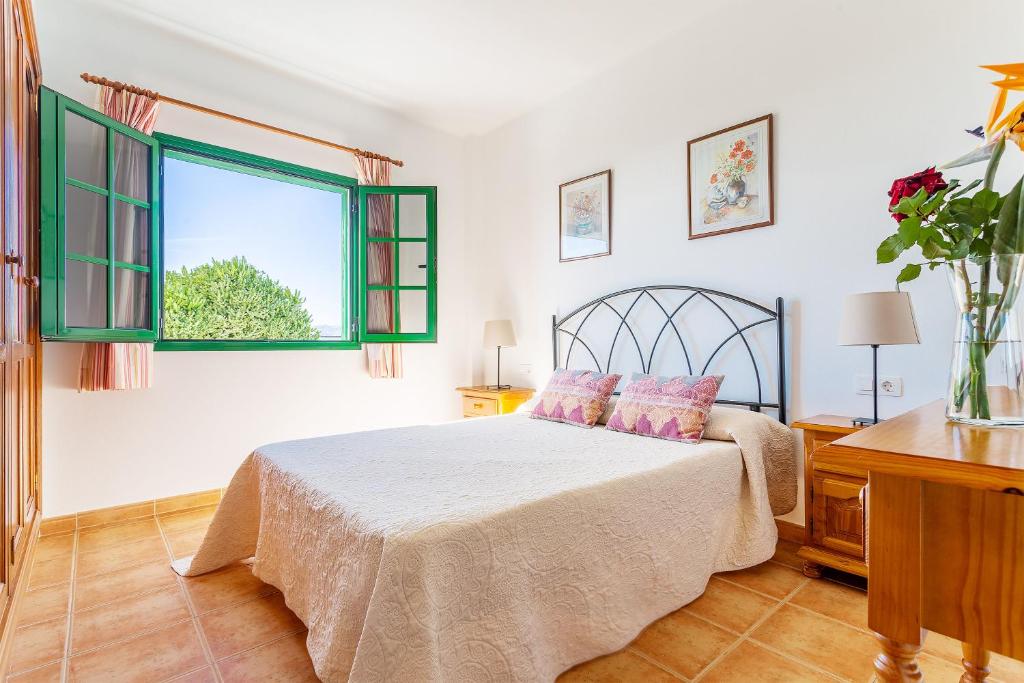 Postel nebo postele na pokoji v ubytování Apartamentos los Quiqueres