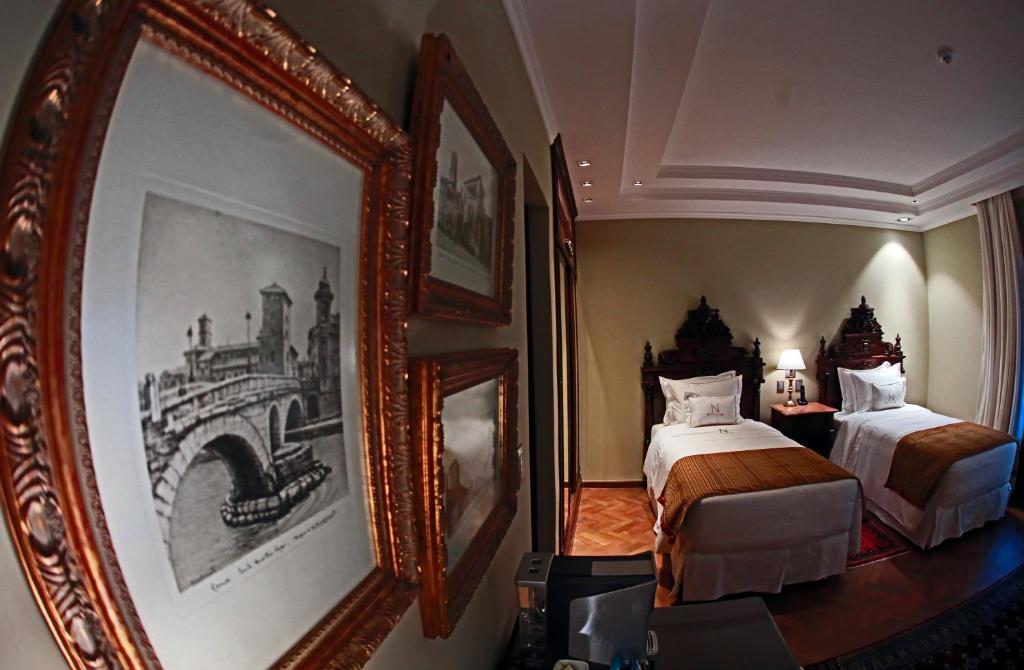 Cama ou camas em um quarto em Nino Hotel Boutique