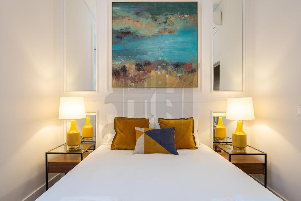 Ένα ή περισσότερα κρεβάτια σε δωμάτιο στο Morgan-Jupiter Apartments