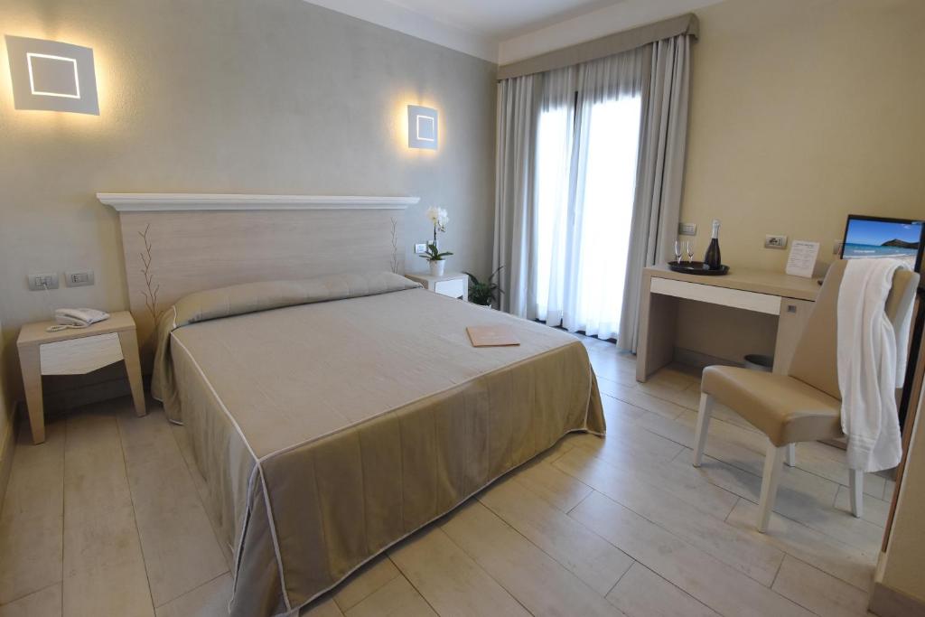 Postel nebo postele na pokoji v ubytování Hotel Belvir