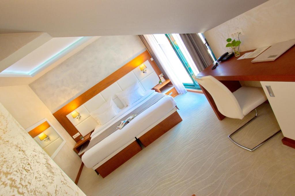 Postel nebo postele na pokoji v ubytování Hotel Porto In