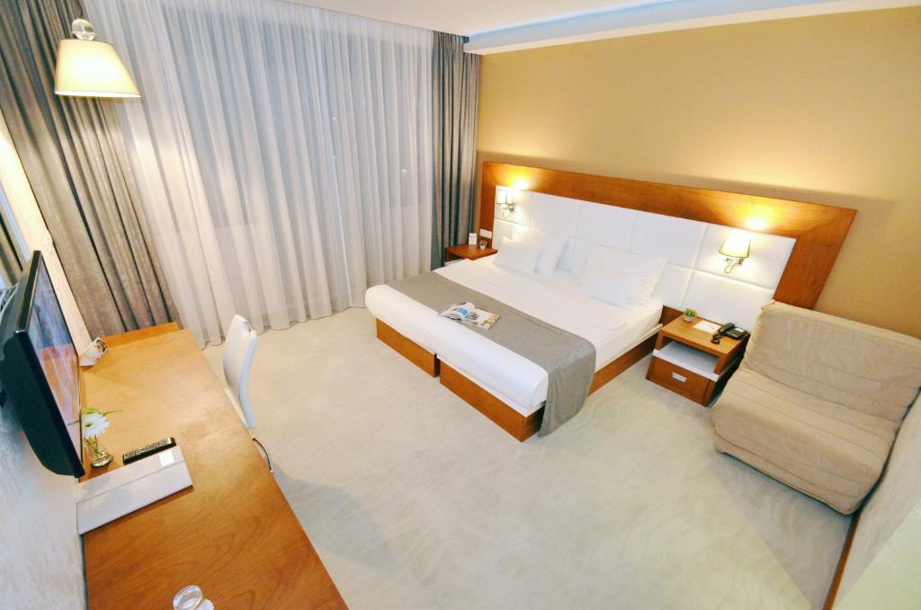 Postel nebo postele na pokoji v ubytování Hotel Porto In