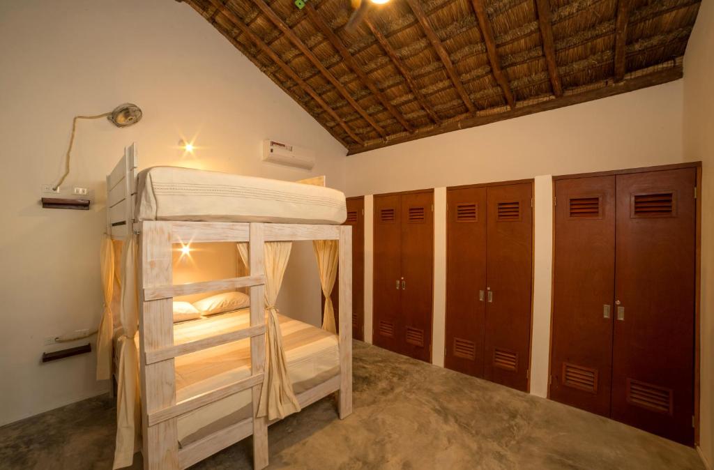 Una cama o camas en una habitación de Mimosa Tulum