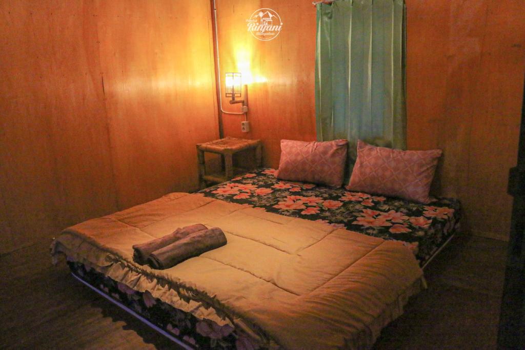 Voodi või voodid majutusasutuse Pondok rinjani bungalow tetebatu toas