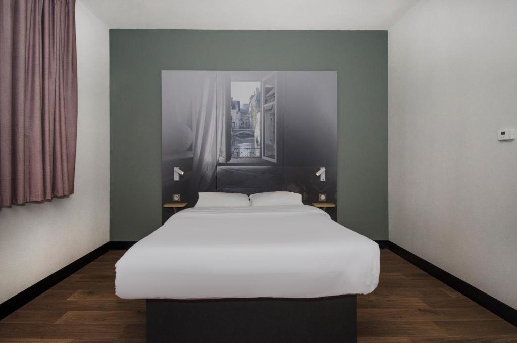Postel nebo postele na pokoji v ubytování B&B HOTEL Montargis-Amilly