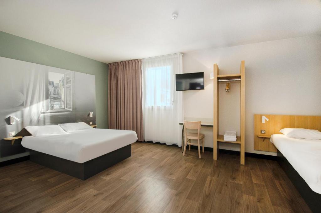 Postel nebo postele na pokoji v ubytování B&B HOTEL Montargis-Amilly