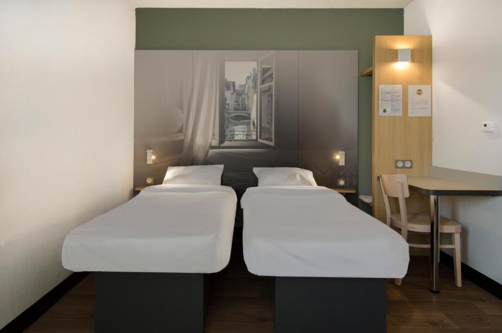 Postel nebo postele na pokoji v ubytování B&B HOTEL Montargis-Amilly