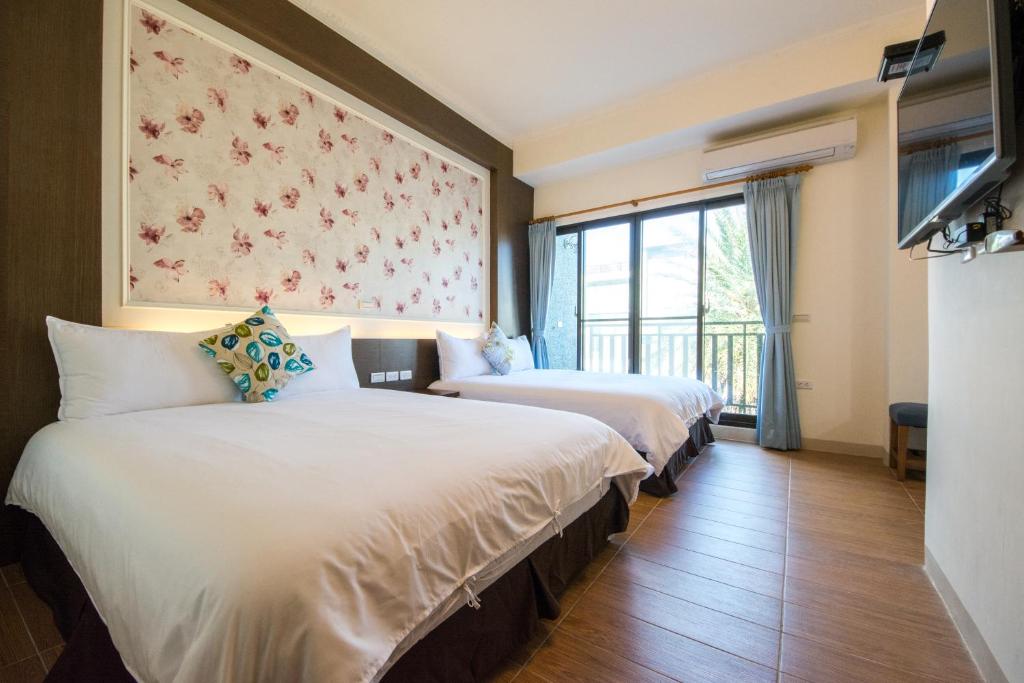 Postel nebo postele na pokoji v ubytování Sioufu B&B