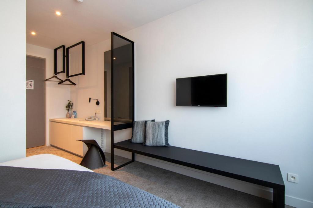 Postel nebo postele na pokoji v ubytování Hotel Pax