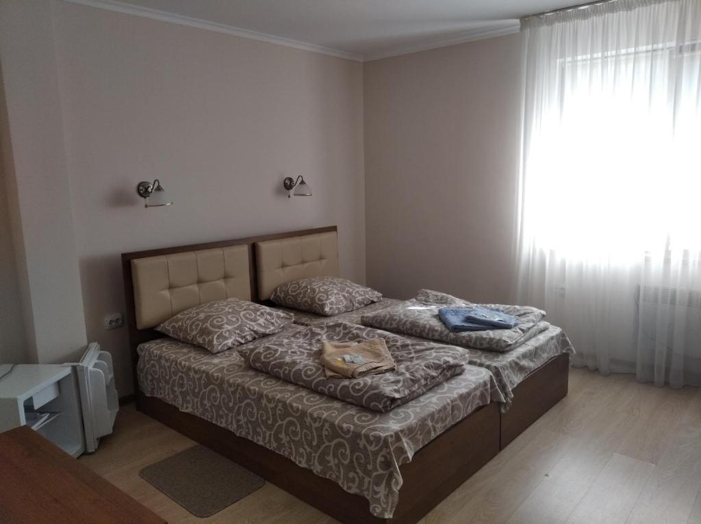 Postel nebo postele na pokoji v ubytování Згадка