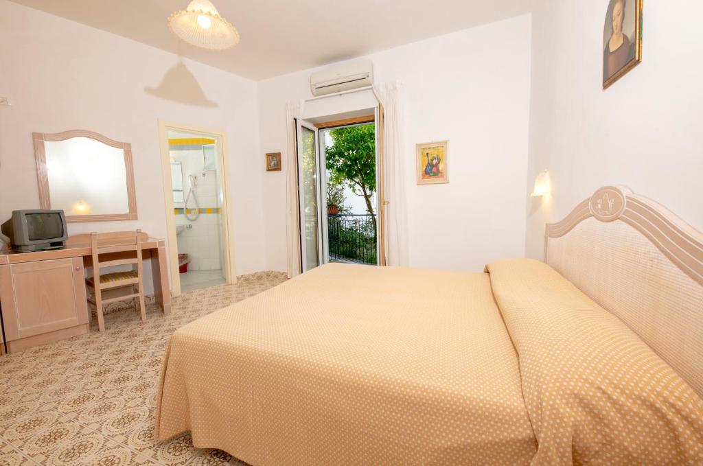 Postel nebo postele na pokoji v ubytování Hotel Candia