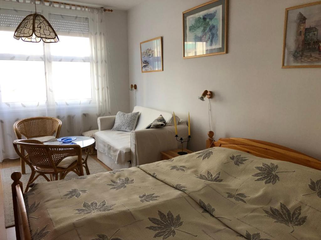 Posteľ alebo postele v izbe v ubytovaní Centrum 2 Apartmanok