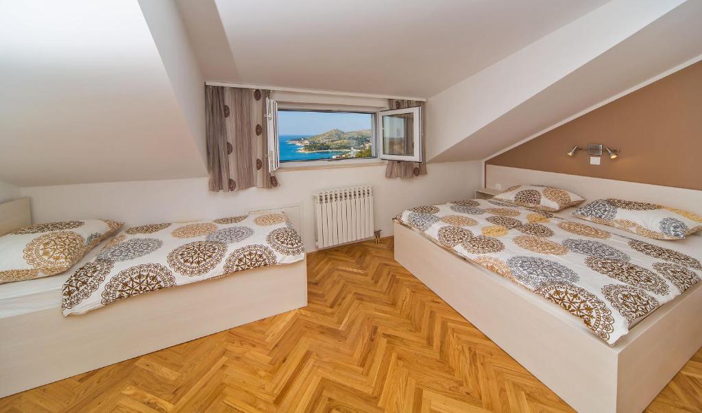 Posteľ alebo postele v izbe v ubytovaní Apartment Residence Narona