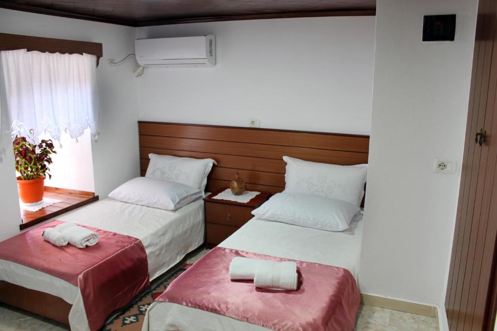 Postel nebo postele na pokoji v ubytování Yuri Guest House