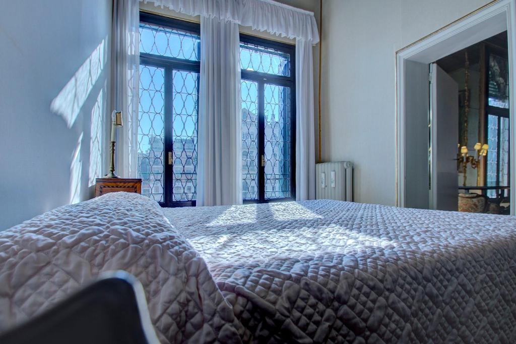 Postel nebo postele na pokoji v ubytování RABOSO Grand 9-windows