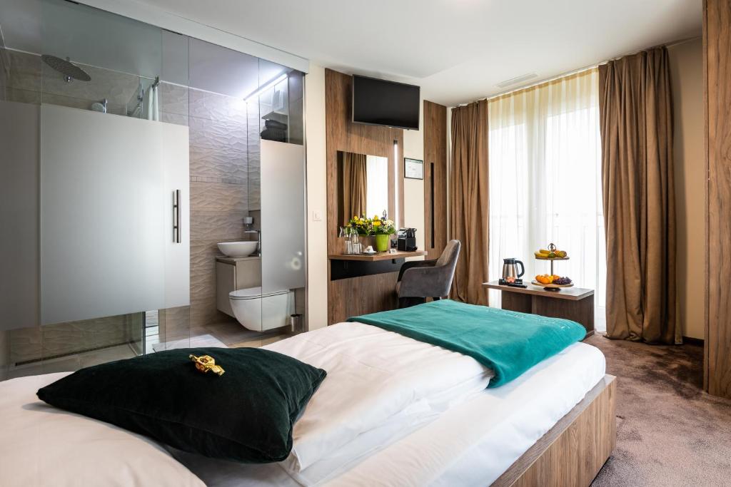 Postel nebo postele na pokoji v ubytování The Gate Boutique Hotel Zürich