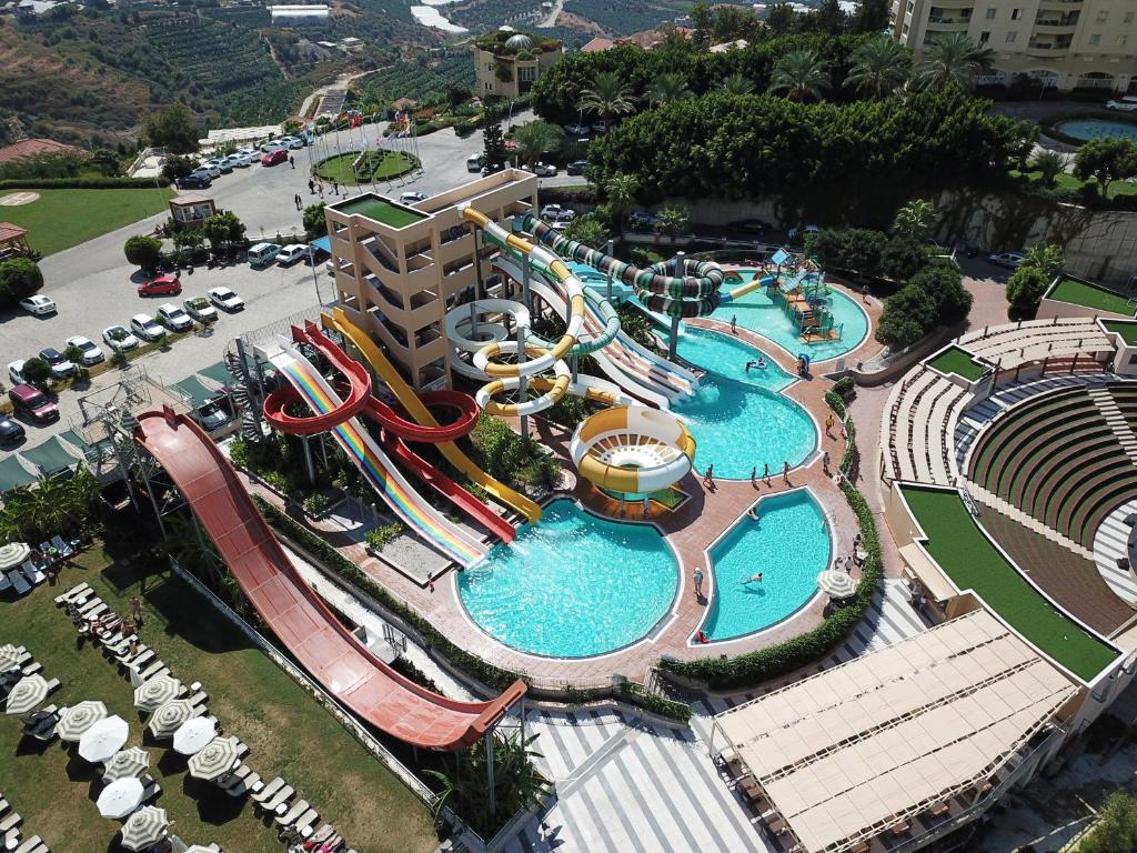 an aerial view of a water park with a water slide at Alanya Goldcity 2 bedroom villa in Alanya