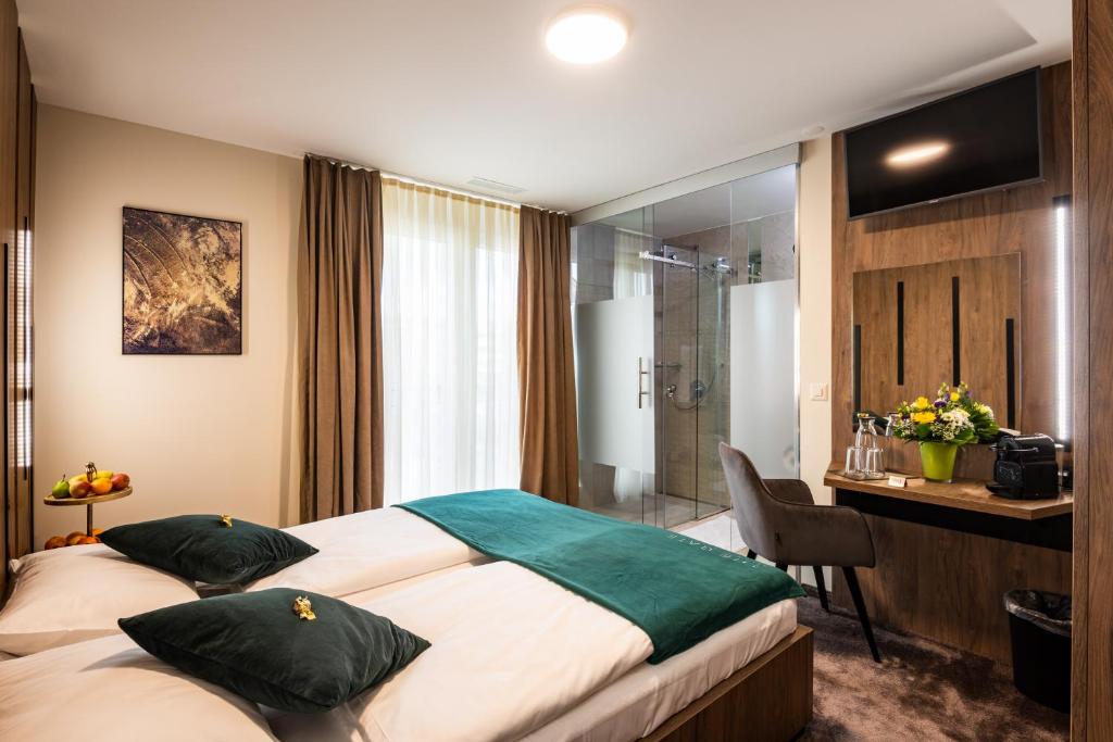 Postel nebo postele na pokoji v ubytování The Gate Boutique Hotel Zürich