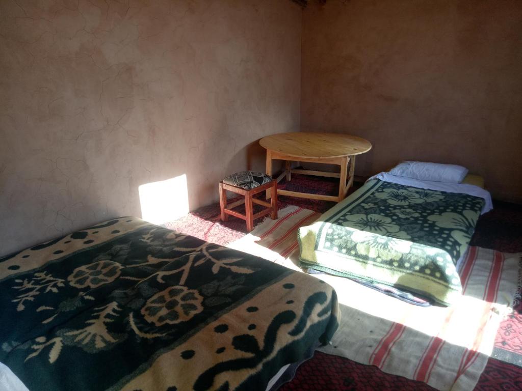 Postel nebo postele na pokoji v ubytování Sahara Peace