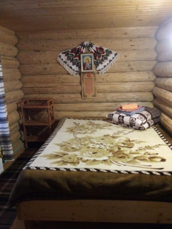 Postel nebo postele na pokoji v ubytování Cottage Лісовий